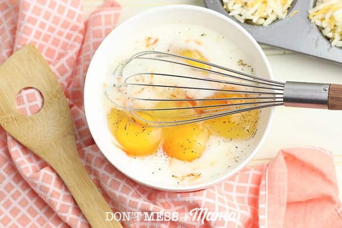 eggs and milk in a white mixing bowl
