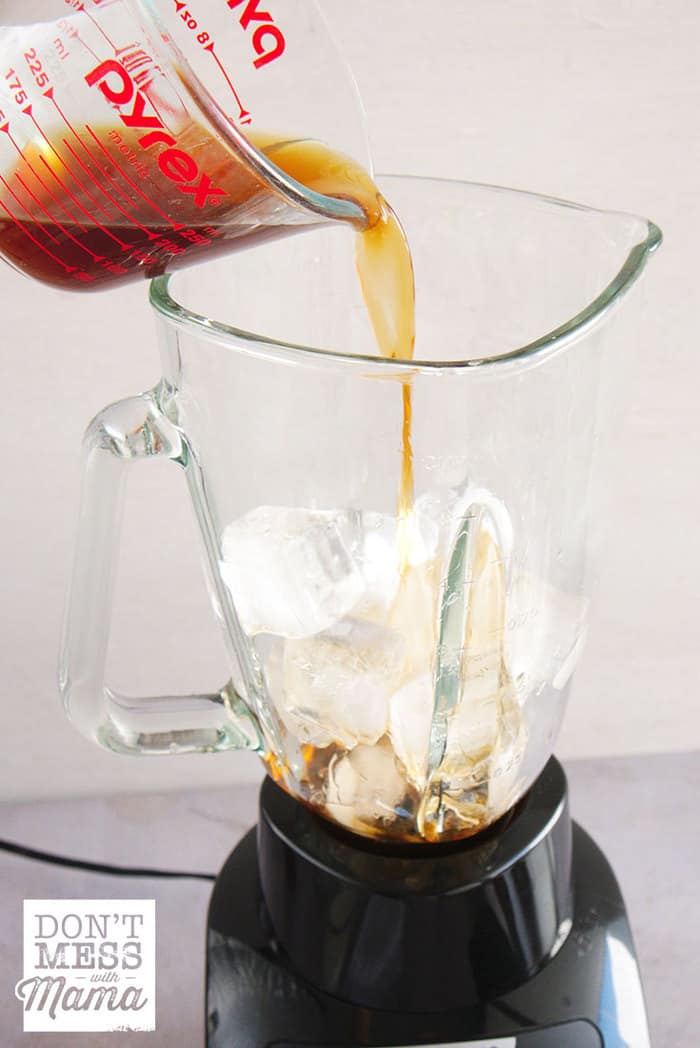 Add coffee and ice to a blender