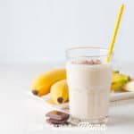 Vegan Coconut Smoothie in a glass with a yellow straw