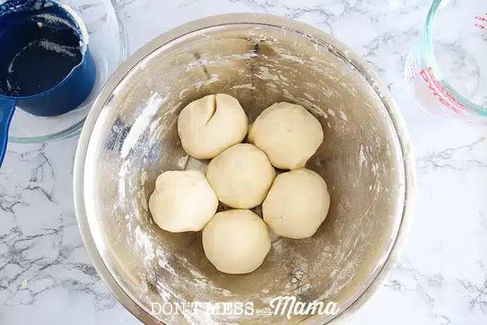 6 playdough balls in a mixing bowl