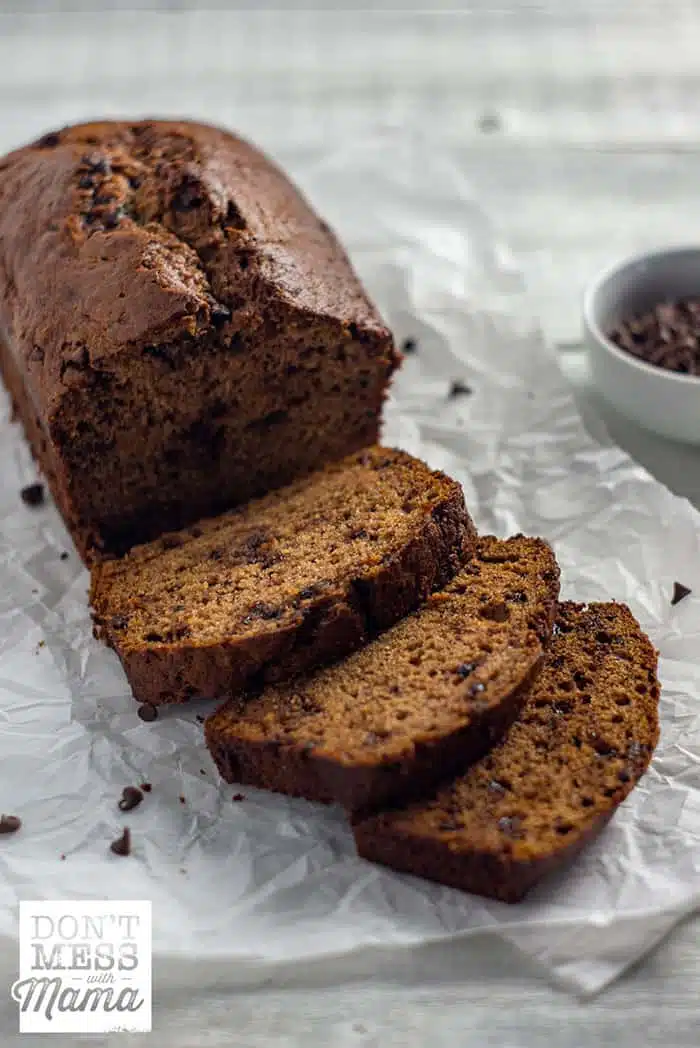 chocolate chip banana bread sliced on parchment paper