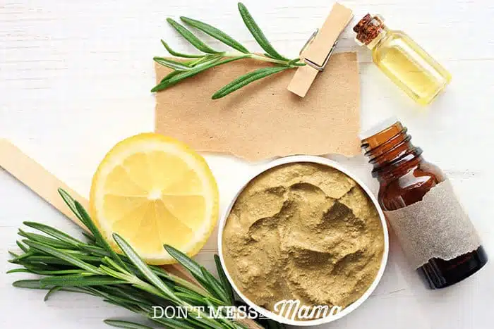 Closeup of rosemary, small bottles, face mask - all homemade acne remedies
