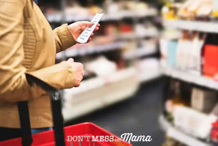 Woman holding a list in a grocery store