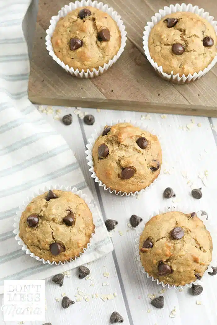 overview of banana chocolate chip muffins on a table 