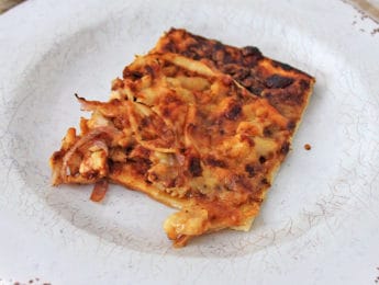 white plate with pizza slice