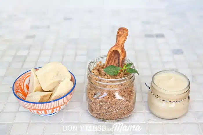 Cacao Butter in a bowl, brown sugar in a glass jar, coconut oil in a glass jar
