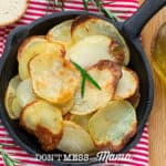 Homemade Potato Chips with Coconut Oil in a skillet on a table