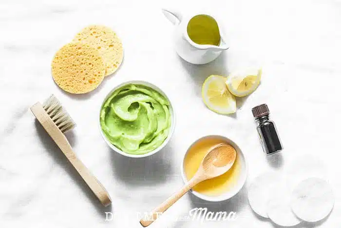 Closeup of honey, avocado and ingredients to make DIY face masks