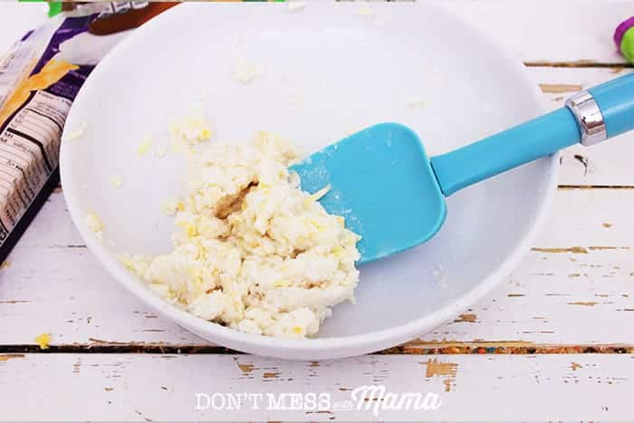 Closeup of cheese cracker dough in a white bowl