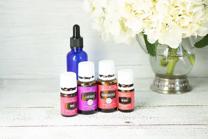DIY Facial Serum on table with bottles of essential oil