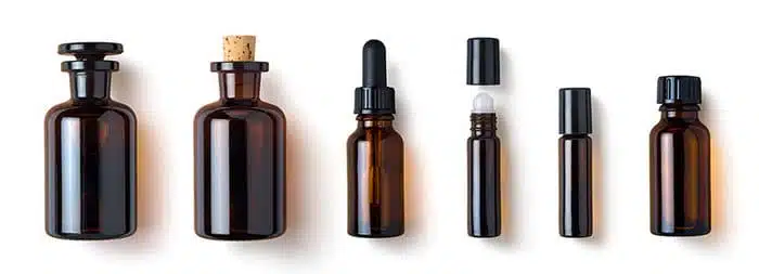 a row of brown bottles for essential oils