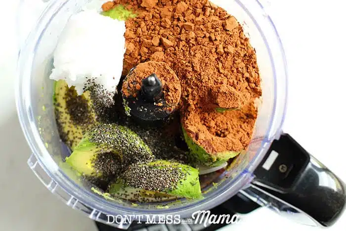 cocoa powder, avocados, chia seeds, coconut oil in a food processor