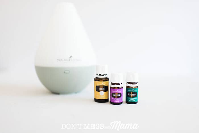 Essential oils next to an oil diffuser