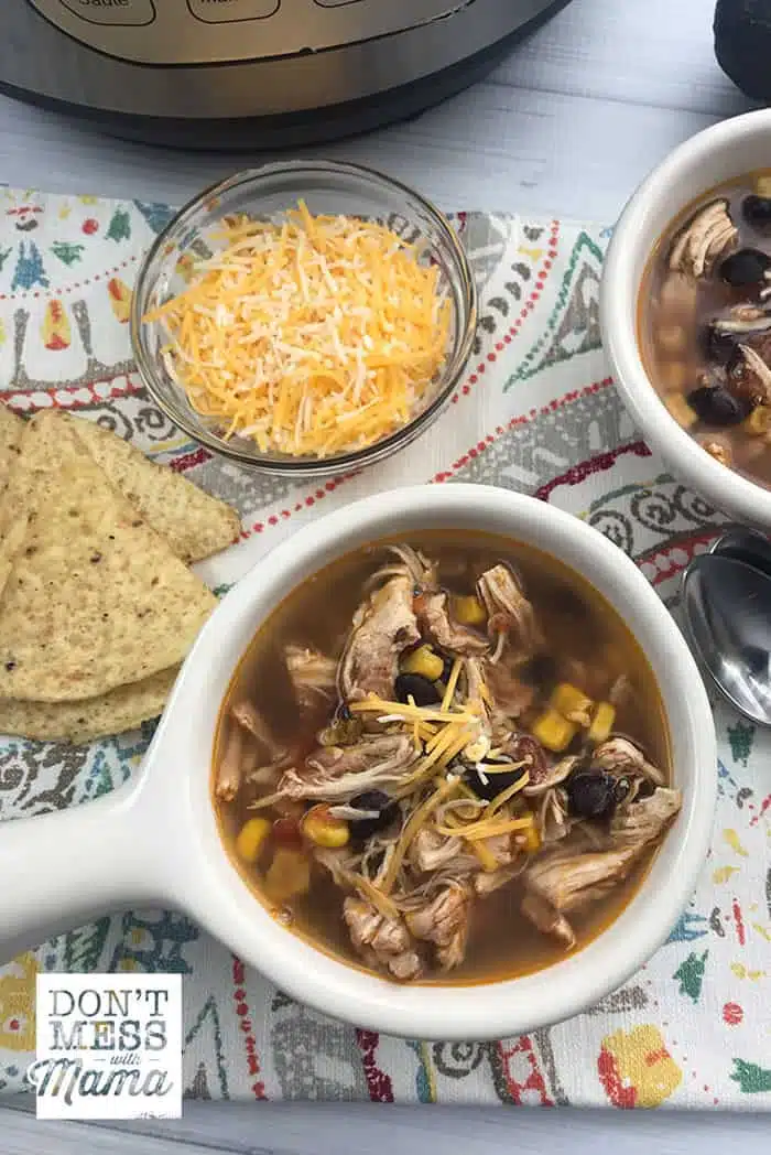 Close up of Instant Pot Chicken Tortilla Soup in a white bowl