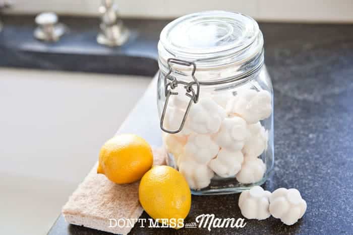A glass jar filled with toilet bomb fizzies- A DIY toilet cleaner