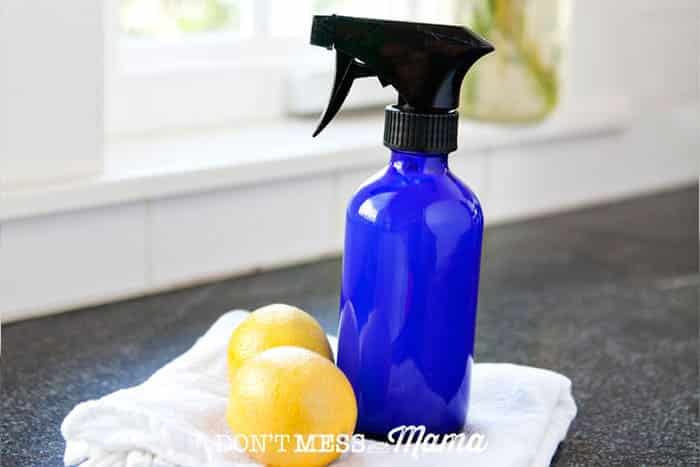 natural cleaning hack a disinfecting spray on a table with lemons