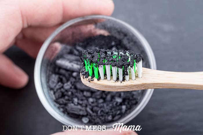 Closeup of toothbrush with activated charcoal
