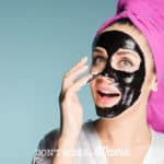 woman applying a Charcoal Peel-Off mask