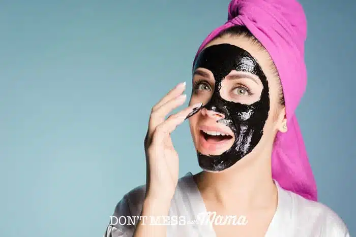 Woman applying a DIY Charcoal Peel-Off Mask 