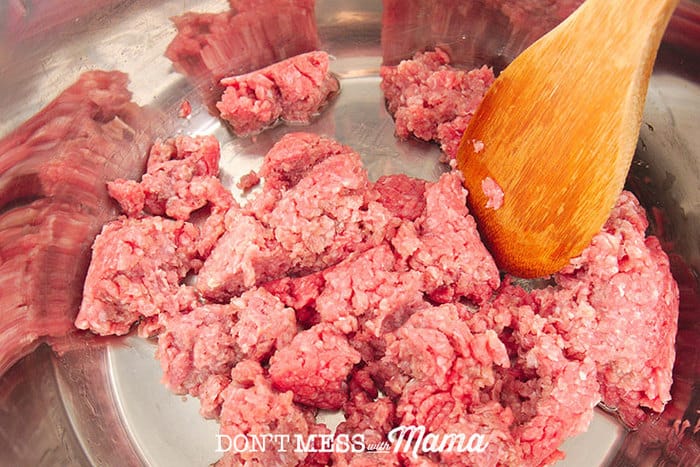 Closeup of ground beef cooking in an Instant Pot