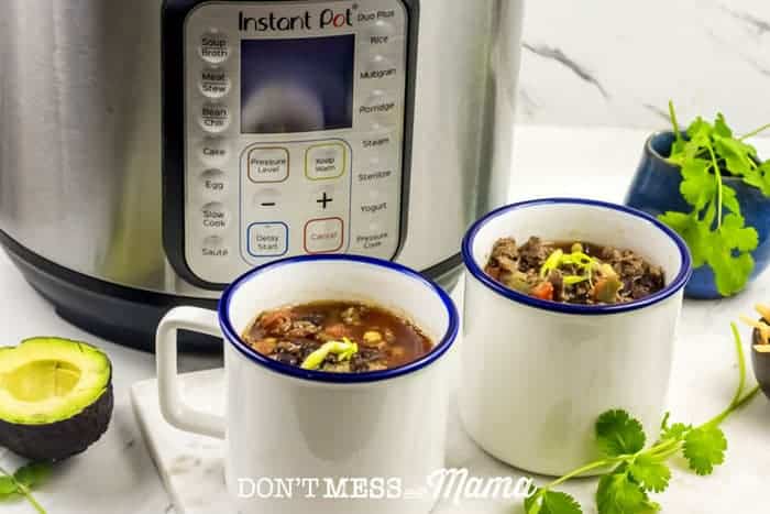 Closeup of taco soup with an Instant Pot in the background