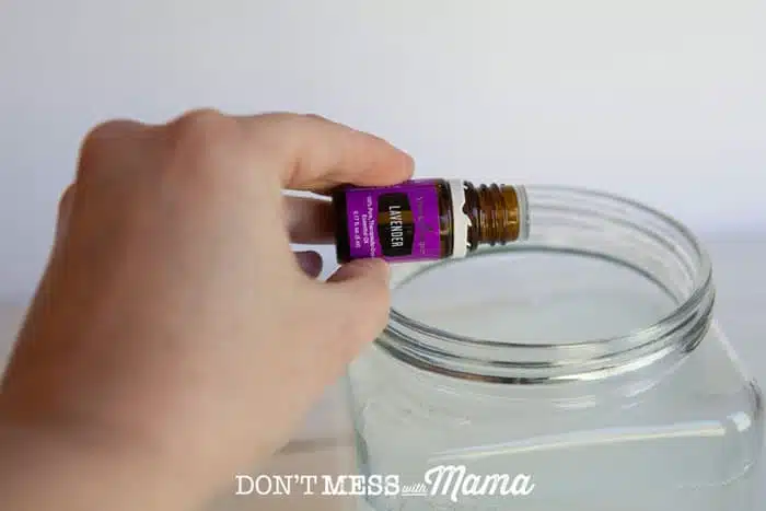 adding essential oil to container