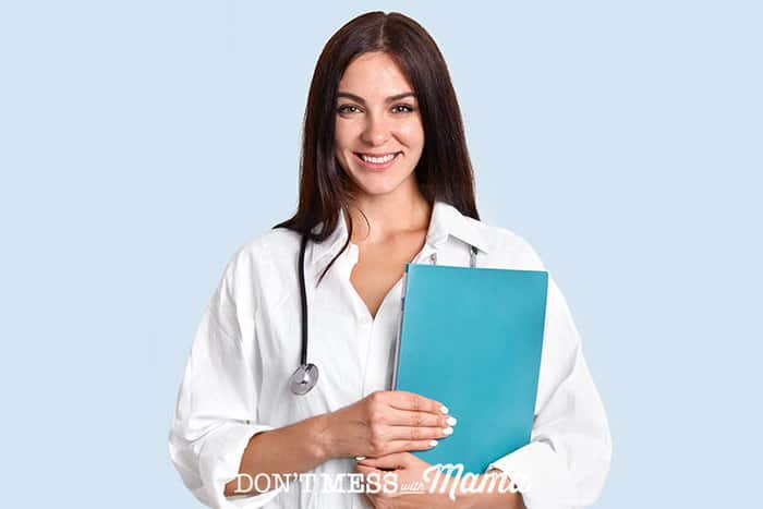 Photo of young female doctor holding a folder with a stethoscope around her neck