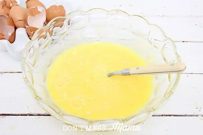 Closeup of beaten eggs in a bowl