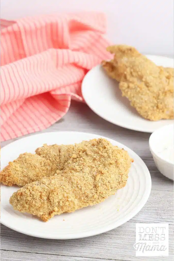 Gluten-Free Chicken Strips on a white plate on a counter - part of the family friendly healthy meal plan