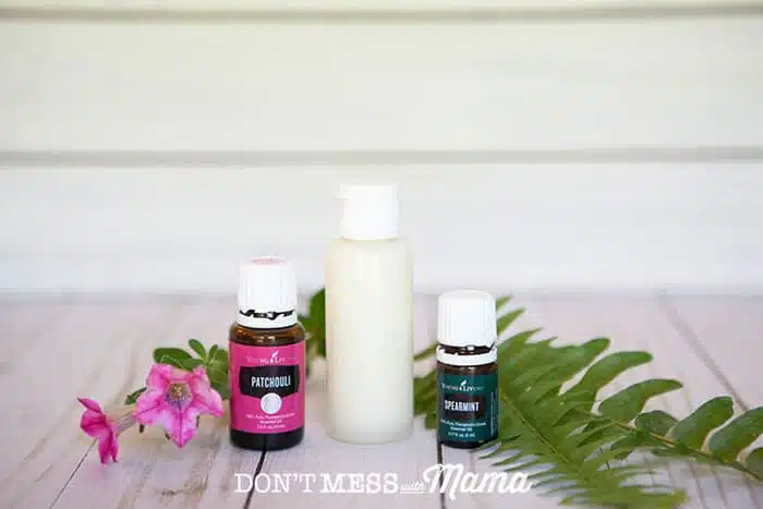 DIY Body Wash in a bottle next to two bottles of essential oils