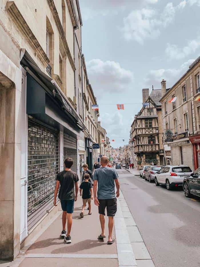 family walking down Parisian street