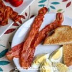 Crispy Air Fryer Bacon on a plate with toast and eggs