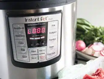 Instant Pot next to some raw beef in a tray
