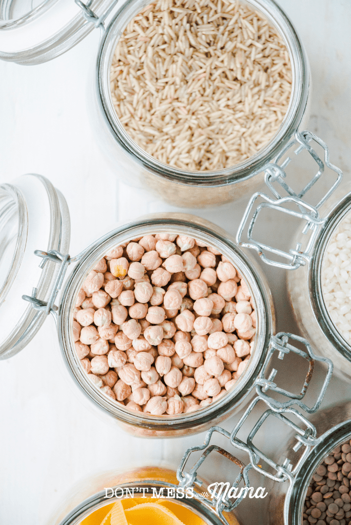 open mason jars with rice and dried chickpeas