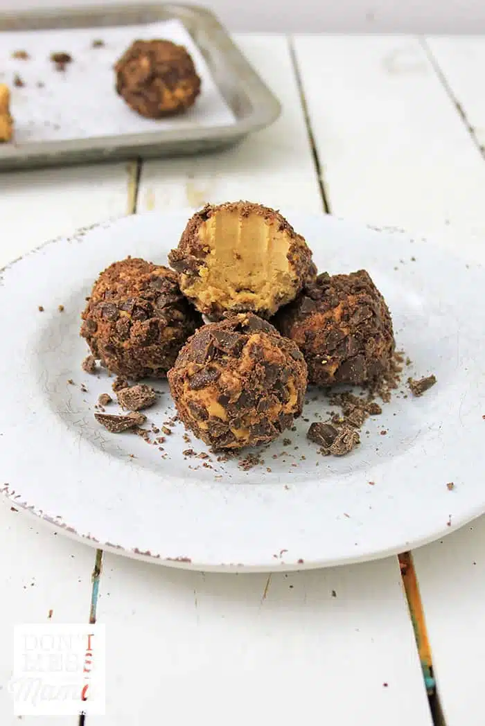 chocolate peanut butter balls on a white plate