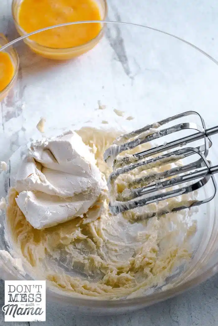 using a hand mixer to mix cream cheese 
