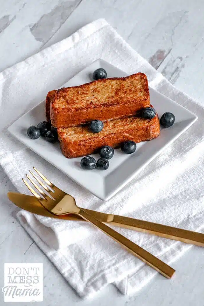 low-carb french toast on a white plate with blueberries