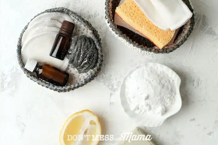 Cleaning supplies and essential oils on a table