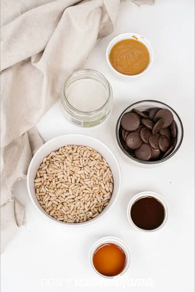 ingredients to make puffed rice bars like chocolate, puffed rice and honey