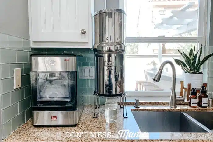 Berkey water filter on counter top in kitchen next to ice machine