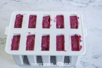 white popsicle mold with mixed berry
