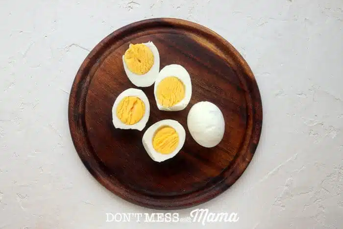 BROWN PLATE WITH SLICED BOILED EGGS