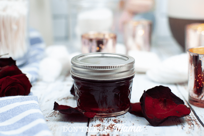 jar of rose water toner with rose petals
