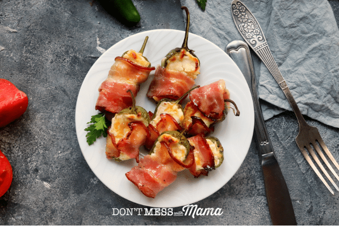plate with bacon wrapped jalaepno poppers