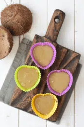 almond butter mixture layered in a silicone muffin cups