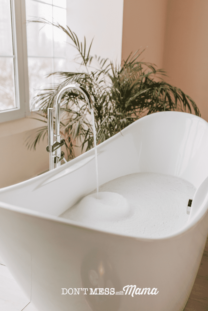 white bath with tap running