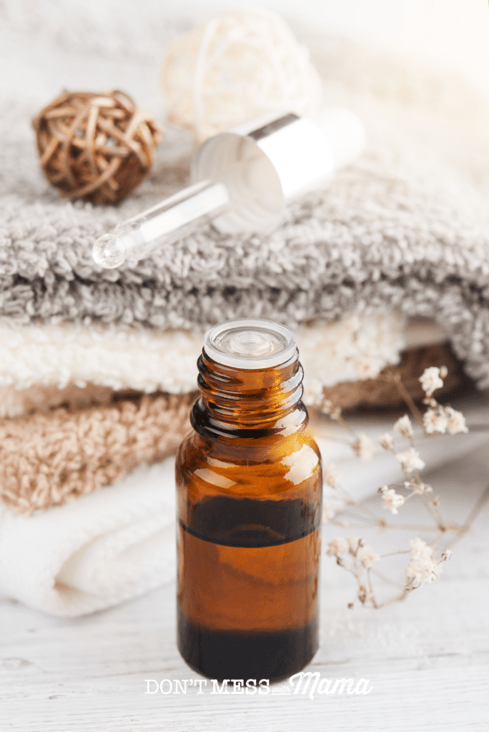 essential oil bottle with towels
