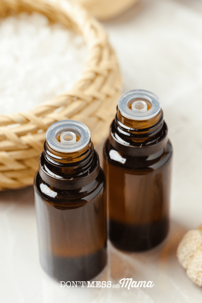 two amber essential oil bottles