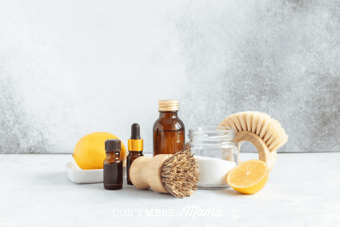 essential oil, citric acid and lemon with scrub brush