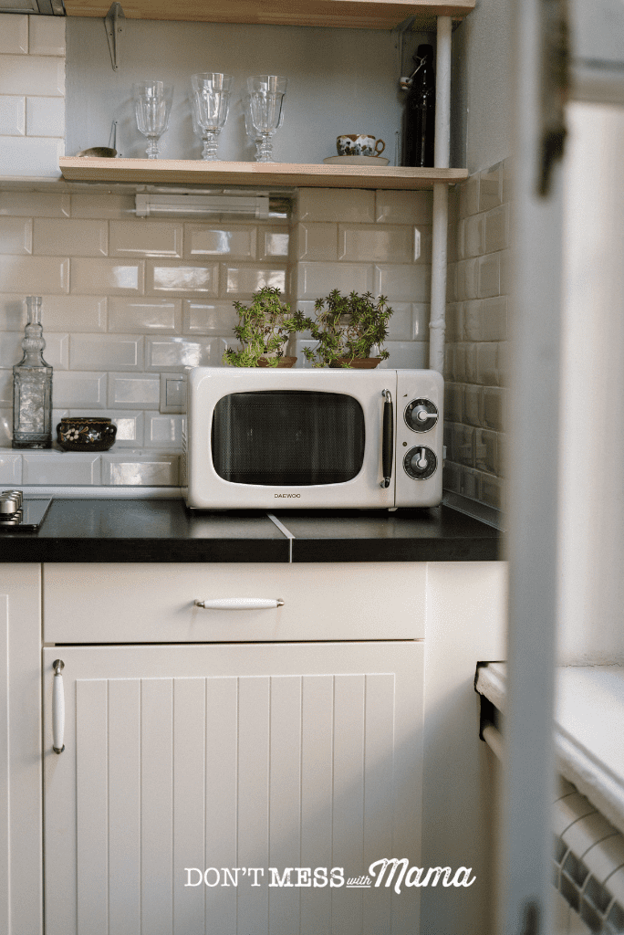 white microwave in farmhouse kitchen